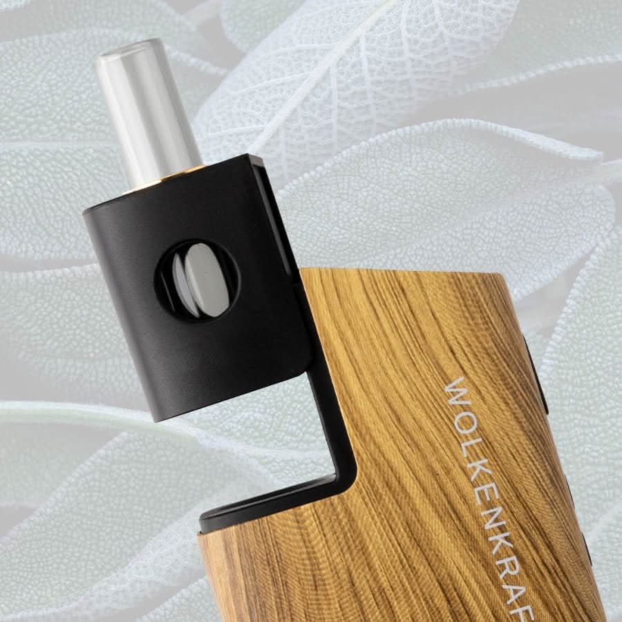Wolkenkraft FX Mini Ultra Vaporizer in Echtholz mit modernem Design vor einem Blatt-Hintergrund. Technologie trifft Natur.